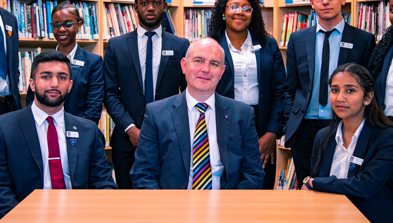 School principal Mr Smith with sixth form students